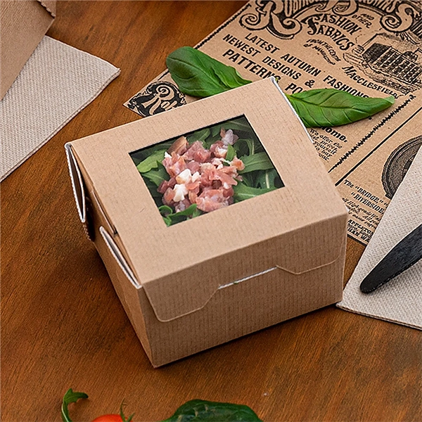 Caixa de Take Away com comida em cima de uma mesa